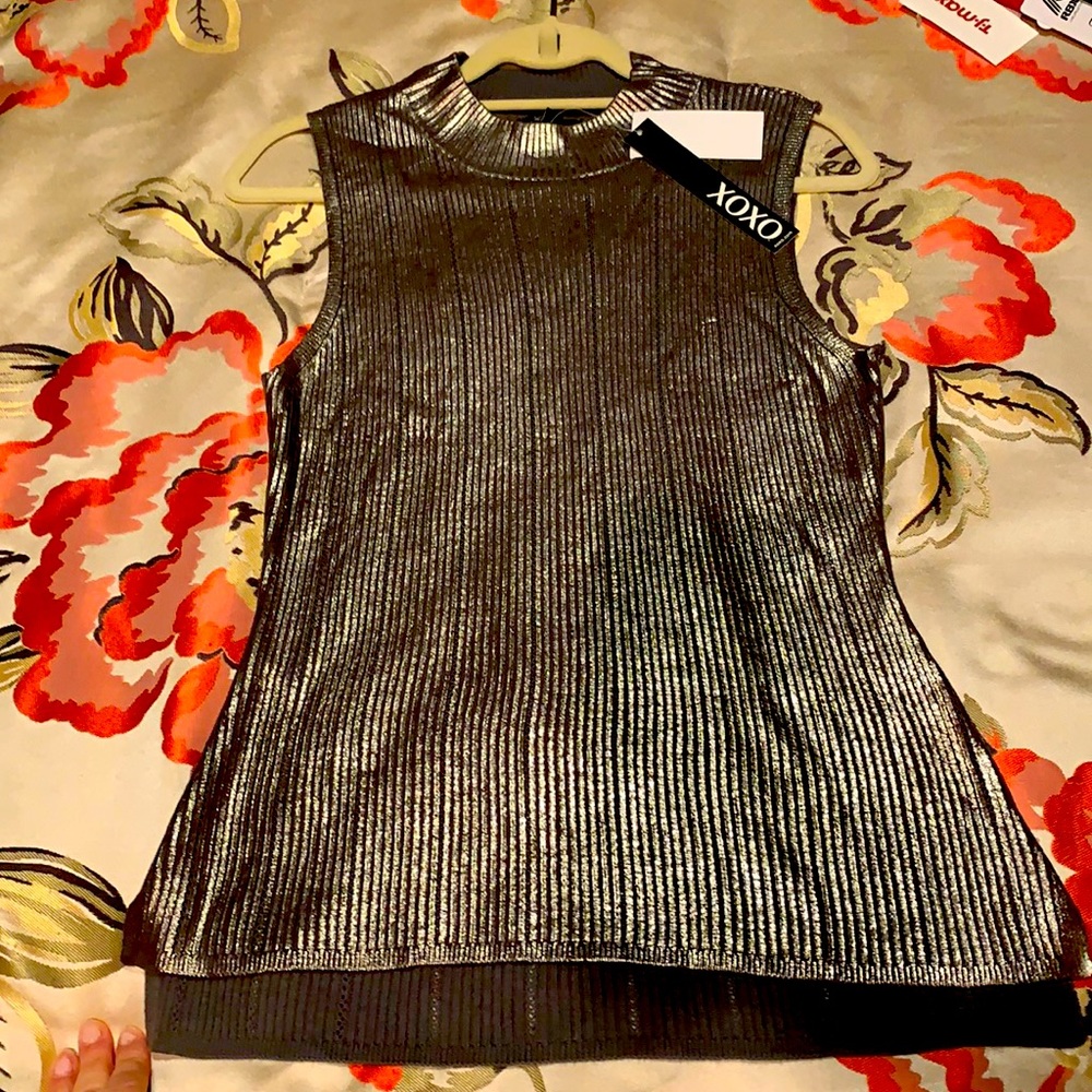 Sleeveless, mock turtleneck, knit top.